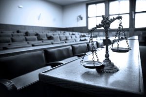 Symbol of law and justice in the empty courtroom, law and justice concept, blue tone