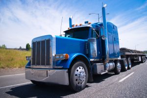 Classic blue bonneted big rig semi truck