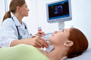 Photo of a doctor inspecting a patient