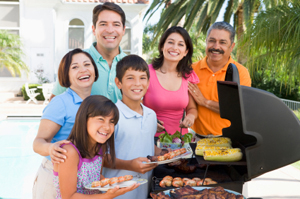 Photo of two families at a backyard cookout