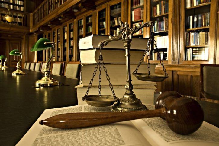 Symbol of law and justice in the empty courtroom, law and justice concept, blue tone