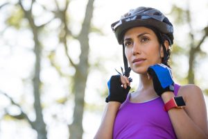 Bike rider wearing bicycle helmet in countryside