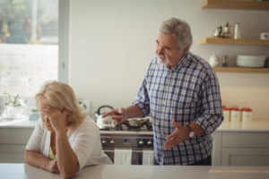 Senior couple arguing in kitchen at home