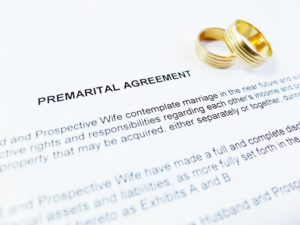 Premarital Agreement with Wedding Rings close up