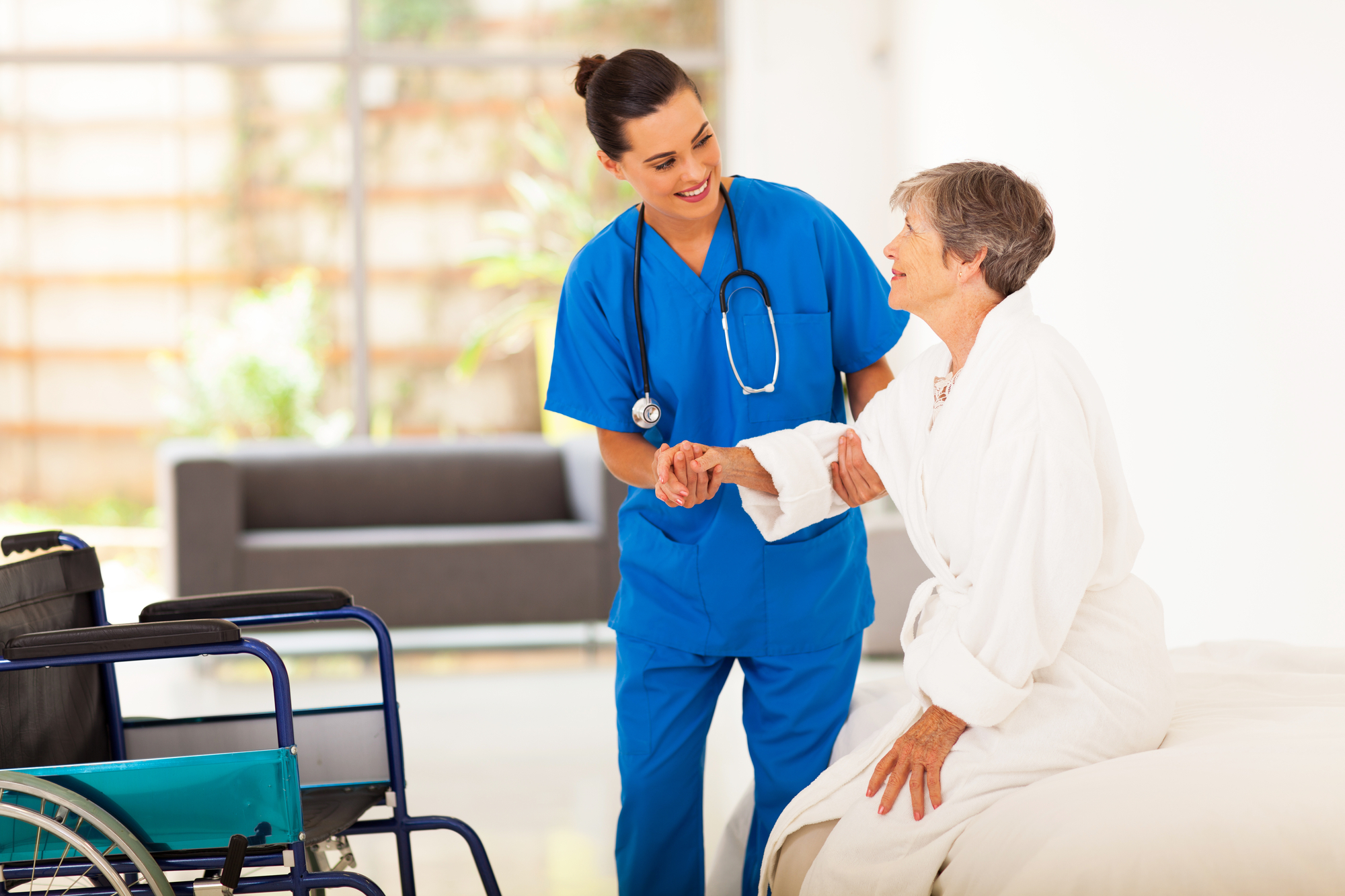 caregiver helping senior woman